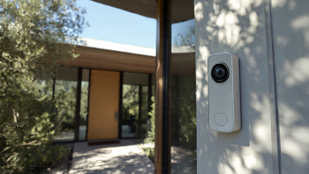 Google Nest Doorbell 2 mounted outside a modern home.