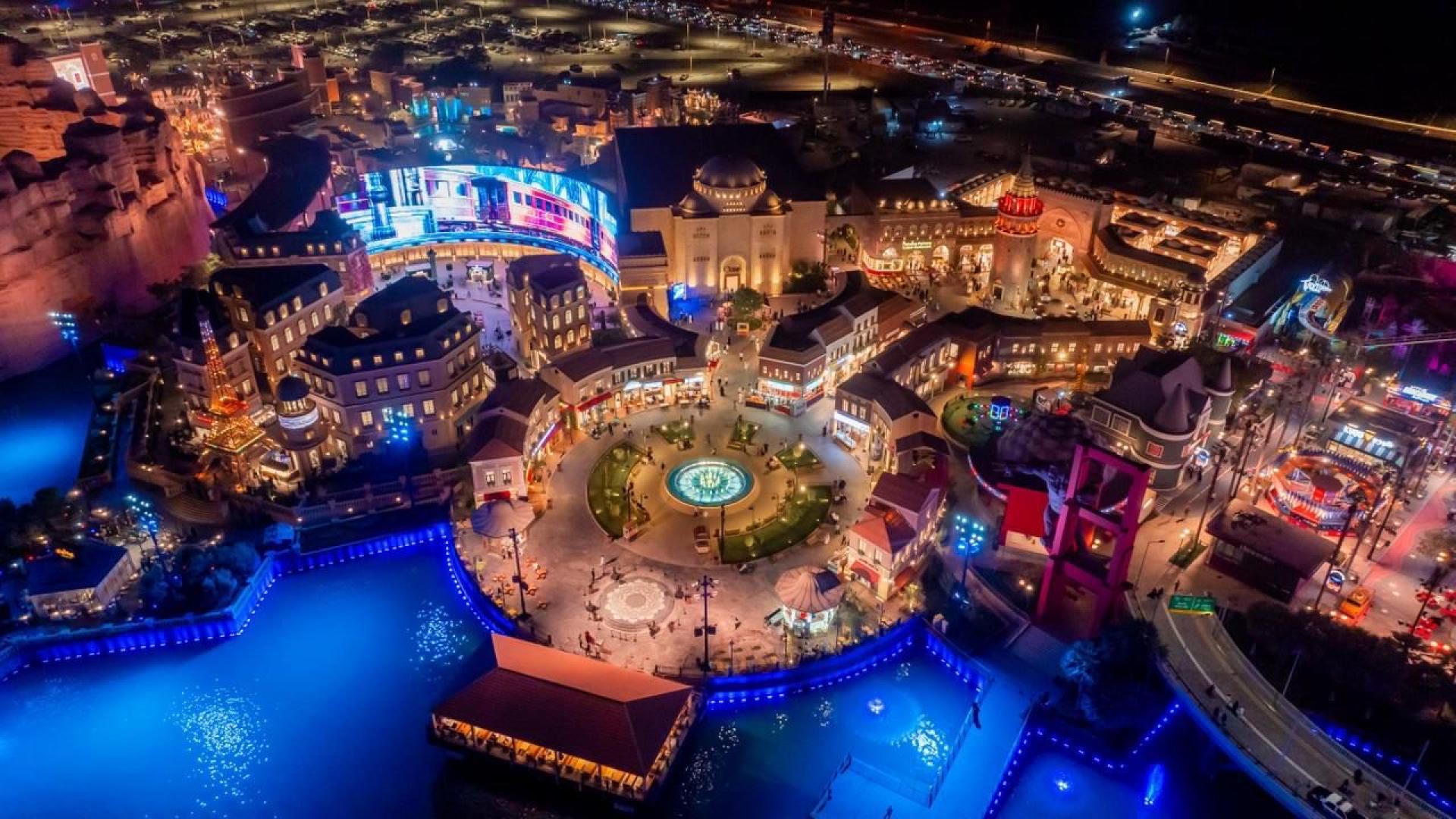 Beast Land Riyadh overview with lit attractions.